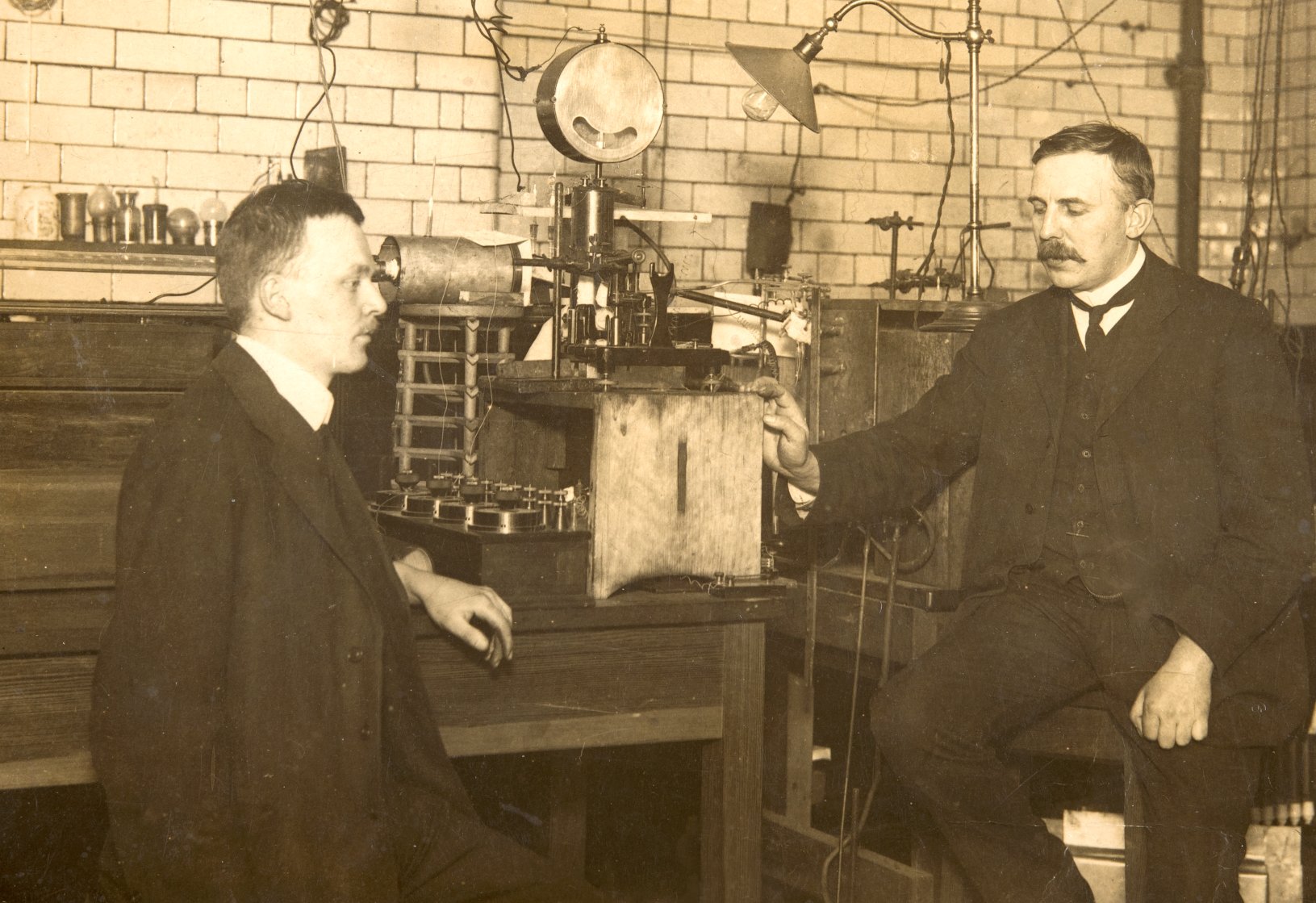 Ernest Rutherford and Hans Geiger (of Geiger tube fame) in the Manchester physics laboratory, 1912.