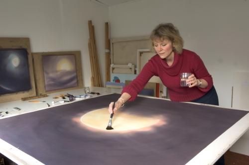 Rebecca Hind painting a moon