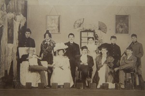 Summer Fields school photograph of 'A Regular Fix' cast in costume including Moseley in centre back (1900).