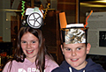 Two eccentric participants show off their hats!